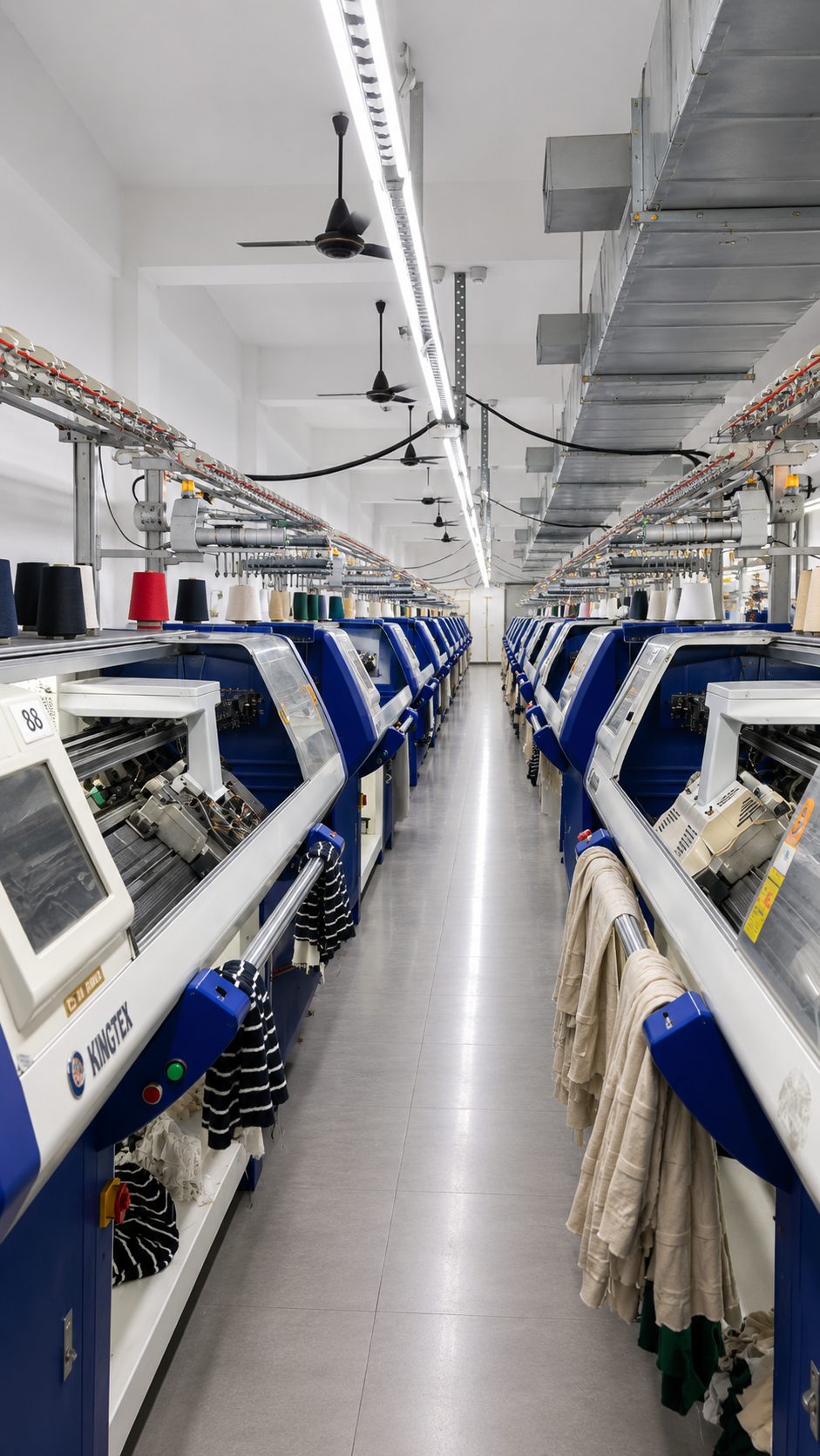 Flat knitting machine aisle at Plot 180